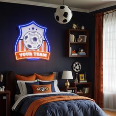 a bed room with a neatly made bed and a soccer ball on the wall above it