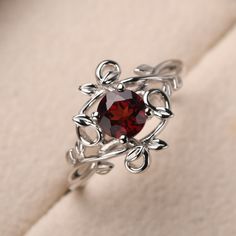 This ring features a (6*6 mm round cut natural garnet). Customization is available. It is made by hand, and it will take about 7 days to finish the ring after your payment is completed. Main stone: 6*6mm round cut natural garnet Main stone weight: 1.21 ct Metal type: sterling silver finished with rhodium/14k gold Accent stone: None Customization is available, I also can make it with 14k solid gold (white or yellow or rose) and diamond accent stone, just feel free to contact me. Any question, jus Garnet Silver Ring, Unique Silver Engagement Rings, Unique Garnet Ring, Fairytale Engagement Rings, Garnet Wedding Rings, January Birthstone Rings, Gemstone Ring Silver, Couples Ring Set, Fancy Rings