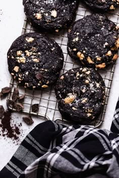 chocolate cookies with walnuts on a cooling rack