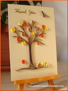 a card with buttons on it and a tree made out of paper that says, thank you