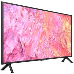 an image of a tv screen with pink and orange paint on the screen, it's black legs