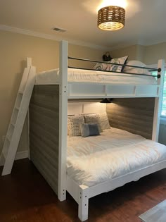 the bunk bed is made up and ready for someone to use it in their home