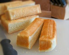 slices of bread sitting on top of a cutting board