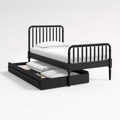 a bed with two drawers underneath it