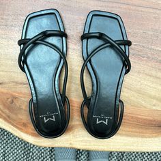 Never Worn Black Sandals With Medium Width Flat Heel, Black Slingback Sandals With Flat Heel, Black Synthetic Flat Heel Slingback Sandals, Black Open Toe Synthetic Slingback Sandals, Black Flat Synthetic Slingback Sandals, Black Open Toe Slingback Sandals, Black Flat Sandals With Heel Strap, Black Synthetic Closed Toe Slingback Sandals, Trendy Black Flat Heel Slingback Sandals