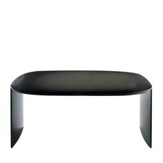 a black table sitting on top of a white floor