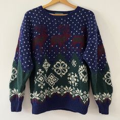 an ugly sweater hanging on a hanger