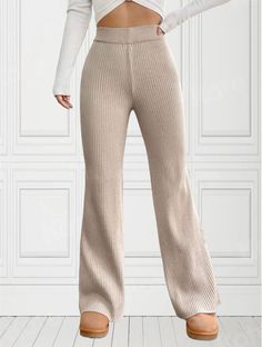 Turn heads in these stylish and comfortable tan ribbed knit flare pants. Made from a soft and stretchy fabric, these pants are perfect for any occasion. The high-waisted design flatters your figure, while the flared legs create a flattering silhouette. Dress them up with a blouse and heels for a night out, or dress them down with a t-shirt and sneakers for a day on the go. Features: High-waisted design Flare legs Ribbed knit fabric Stretchy and comfortable Available in a variety of sizes and col Ribbed Knit Flare Pants Outfit, Ribbed Flare Pants Fall, Knit Flare Pants, Fitted Ribbed Knit Pants, Flare Ribbed Pants For Loungewear, Beige Ribbed Knit Bottoms, Flare Lounge Pants, Wide Leg Leggings, Tan Skirt