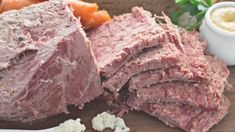 sliced meat and vegetables on a cutting board