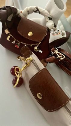 Longchamp Bag Accessories, Bags With Keychain Aesthetic, Shopping Wishlist Aesthetic, Mini Longchamp Bag Aesthetic, Longchamp Bag Charm, Longchamp Mini Pouch, Longchamp Pouch Outfit, Long Champ Bag Mini, It Girl Bags