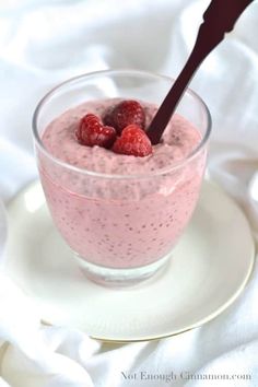 a glass bowl filled with raspberry chia pudding