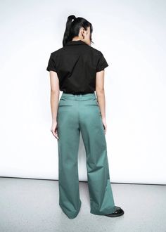 With a high-waisted fit, tab front closure, and double front pleats, this long line loose leg trouser can go from comfortably casual to effortlessly chic. Pair with a graphic tee for everyday styline, or mix with other Essential suiting separates for maximum versatility. Gender Neutral Clothes, New Shop, Best Sellers, Graphic Tee, Full Length, Wide Leg, Graphic Tees, Trousers, High Waisted