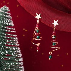 These Christmas tree spiral dangle drop earrings feature spiral wire in Christmas tree shape with a star on the top and red and green crystal beads as ornaments. The Christmas tree dangle drop earrings are made of solid 925 sterling silver and crystal gemstone bead. These Christmas tree earrings will be a great gift for your loved one on Christmas and holiday occasion. Jewelry Care: See more information about how to care for your jewelry here. Shipping Policy: Orders will be shipped within 1-3 business days. Economy shipping will take 7-14 days to arrive and standard shipping is 1- 4 days for U.S. orders. International shipping time is depended on the country and per shipping method. Shipping cost will be calculated at check out.For more details, see our Shipping Policy. Return Policy: Fre Christmas Tree Spiral, Prepare For Christmas, Xmas Jewelry, Earring Christmas, Christmas Tree Star, Silver Christmas Tree, Cute Christmas Tree, Holiday Earrings, Christmas Tree Earrings