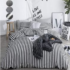 black and white striped bedding in a bedroom