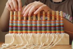 a person is working on an weaving project