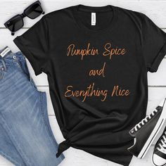 "🍂 Welcome to TheKidWithADream! 🍂  Premium Bella+Canvas 3001 shirt for ultimate comfort and durability. Embrace the cozy vibes of fall with our exclusive \"Pumpkin Spice And Everything Nice\" shirt collection. Fall in love with the season's most beloved flavor, pumpkin spice, and show off your autumn enthusiasm with style! 🎃 Why Choose Our Pumpkin Spice Shirt? 🎃 ✨ Premium Quality: Crafted from soft, comfortable materials, our shirts are designed for both comfort and durability. ✨ Unique Design: Our exclusive \"Pumpkin Spice And Everything Nice\" design is perfect for celebrating the joys of fall. ✨ Versatile Style: These shirts are perfect for pumpkin patch adventures, coffee shop hangouts, or simply lounging at home with a warm cup of cocoa. ✨ Great Gift: Surprise a friend or loved on Cozy Relaxed Fit T-shirt With Graphic Print, Basic Fall Loungewear T-shirt, Cozy Cotton T-shirt With Letter Print, Cozy Black Tops With Graphic Print, Cozy Black Top With Graphic Print, Comfortable Soft-washed Black Tops, Comfortable Fall Loungewear T-shirt, Comfortable Slogan T-shirt For Fall, Cozy Fit Comfortable Tops With Letter Print