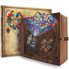 an open book with balloons on it