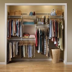 an organized closet with clothes and baskets