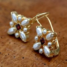 Florentine Cross Pearl and Garnet Earrings Victorian Hallmarked Pearl Earrings As Gift, Elegant Gold Garnet Earrings, Gold Garnet Earrings For Wedding, Gold Garnet Earrings Fine Jewelry, Victorian Earrings Antiques, Pebble Jewelry, Wedding Lookbook, Sabyasachi Jewellery, Demi Moore