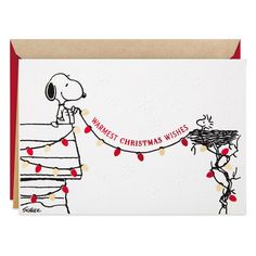 a christmas card with a snoopy dog holding a basket full of presents on it