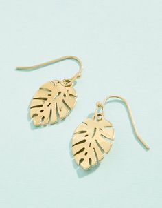 Did someone say tropical vacation? These Monstera Leaf Earrings will make you feel as though you are on a tropical island everyday. Designed to shine through everyday wear, exercise, showers and a summer at the beach in tarnish free 14kt gold vacuum plating. Yellow Gold Drop Earrings For Summer, Trendy Gold Earrings For Summer, Summer Gift Yellow Gold Earrings, Gold Drop Earrings For Vacation, Yellow Gold Jewelry For Vacation, Gold Earrings For Summer, Trendy Gold Leaf Jewelry, Trendy Silver Earrings For The Beach, Trendy Dangle Earrings For Vacation