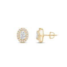 a pair of diamond earrings in yellow gold with diamonds on each ear and an oval shape