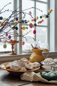 plates with food on them sitting in front of a window