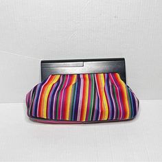 Women’s Nine West Bright & Colorful, Large, Rainbow Stripe Clutch Bag With Contrast Black Wood Handle. Condition: In Very Good, Very Clean, Undamaged, Gently Used, Or Unused, Preowned Condition. No Defects. No Flaws. Tags: Rainbow Bags, Rainbow Handbag, Rainbow Clutch Purse, Women’s Retro Y2k Maximalist Handbag, Women’s Clutches, Women’s Clutch Bag, Rainbow Clutch Bags, Rainbow Bag, Pride Accessories, Pride Week Bags, Best Festival Bags, Rainbow Strip Handbag, Wood Handle Bags, Women’s Bright & Multicolor Clutch Shoulder Bag, Multicolor Summer Clutch Evening Bag, Multicolor Clutch Evening Bag For Summer, Chic Multicolor Clutch For Everyday Use, Chic Multicolor Clutch For Daily Use, Everyday Multicolor Chic Clutch, Chic Multicolor Clutch With Removable Pouch, Multicolor Pouch Evening Bag With Removable Pouch, Multicolor Evening Bag With Removable Pouch