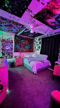 a bedroom decorated in pink, purple and black with lots of lights on the ceiling