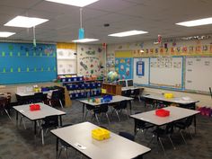 an empty classroom with desks and chairs