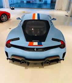 a blue sports car parked in a garage