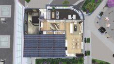 an aerial view of a house and its surrounding courtyard area, including the kitchen and living room