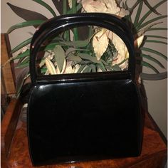 Gorgeous Rare Vintage Palomo Picasso Black Patent Leather Handbag. Snap Handles A Top Are A Patented Design. Black Leather Interior With One Zippered Pocket. Gold Tone Hardware. Euvc ( Excellent Used Vintage Condition). Includes Generic Dust Bag. 10% Discount On A Bundle Of Three Or More Items Paloma Picasso Bag, Vintage Black Shoulder Bag With Brass Hardware, Paloma Picasso Jewelry, Black Saffiano Leather Bag With Gold-tone Hardware, Black Vintage Bag With Snap Closure, Paloma Picasso, Patent Leather Handbags, Leather Interior, Black Patent Leather