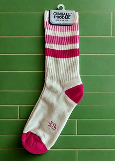 All accessories are final sale Takin' it back to the '80s with these retro socks! Features a more relaxed fit for ultimate comfort and a gentle feel around the calf. Wear them pulled up or scrunched down. Made of natural cotton with accents of fuchsia, flash pink, and dark pink nylon. Super comfy, unisex, one-size-fits-most, and made in the USA. Note: Cream portion is made of natural cotton, so lil darker specks in the fabric will occur. Features: Unisex Gym Crew Socks Wide Rib knit Cushioned fo Comfortable Pink Cotton Socks, Retro White Cotton Socks, White Cotton Retro Socks, Sporty Pink Cotton Socks, Pink Cotton Socks For Stocking Stuffers, Cotton Socks For Spring Stocking Stuffers, Casual Super Soft Pink Socks, Super Soft Pink Casual Socks, Retro Socks