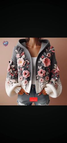 a woman is wearing a jacket with flowers on it