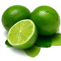 two limes with leaves and one cut in half