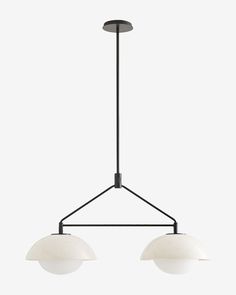 three light chandelier with two white glass shades on the bottom and one black metal frame