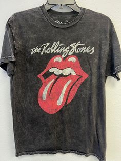 The Rolling Stones Classic Lick In Stones Unisex Tee (Rhinestones Optional-see details below) - 100% Cotton Fabric - Adult Unisex Tee  - Black Colored Tee, Mineral Wash - Available in sizes that fit most: S/M, L & XL - OPTIONAL RHINESTONES: Crystal rhinestones run throughout The Rolling Stones logo on the garment and Ruby rhinestones outline parts of the mouth (see picture in listing photos). Select "No Rhinestones" or "Rhinestones" at checkout. - Fit: the length measurements are approximate due Rolling Stones Tshirt, Rolling Stones Shirt, Rolling Stones Logo, 1960s Music, Music Tees, Rock Band, Rolling Stones, Miss You, Black Tee