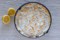 a lemon meringue pie on a wooden table