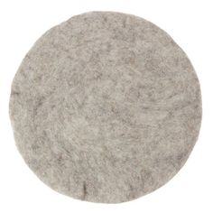 a round gray felt object on a white background