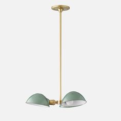 two light green and gold pendant lamp with white glass shades on the bottom, hanging from a brass ceiling fixture