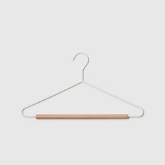 a white hanger with a wooden bar on it