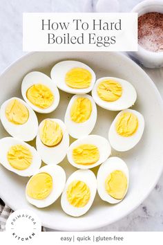 how to hard boiled eggs in a white bowl on a marble countertop with text overlay