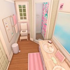 the bathroom is decorated in pastel colors and has pink accessories on the counter top