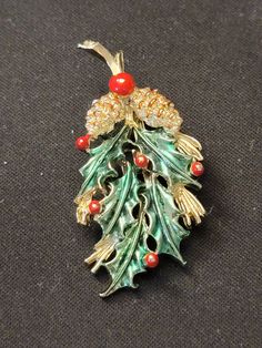 "1970s Signed Gerry's Gold Finish Holly Berries Pinecones Brooch Red Green Enamel Gerrys.  This pretty piece measures 1\" wide by just over 2\" long.   Minor loss of enamel, which is common with these well loved and worn brooches." Holly Berries, Green Enamel, Pine Cones, Red Heart, Gold Finish, Red Green, Brooch Pin, Brooches, 1970s