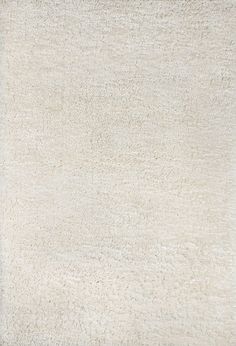 an area rug with white fur on it