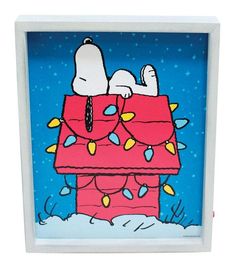 a painting of a snoopy christmas scene in a white frame with blue sky and stars