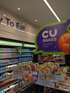 a display in a grocery store filled with baked goods