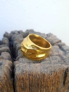 This is a beutifull 14 k gold plated brass, big noticeable ring. A rustic textured statement ring . it is a designer statement ring. A great gift for loved ones or for yourself. This stunning big 14 karat gold plated brass ring, is a very impressive piece. Its a chunky ring that makes a fashionable statement. The ring will look great with both casual & elegant wear. HANDMADE ITEM Materials: This ring is made of 14 karat gold plated brass. You can also choose between Sterling silver black oxi Gold Chunky Ring, Big Statement Rings, Big Ring, Faceted Ring, Chunky Ring, Organic Rings, Wide Ring, Organic Ring, Big Rings