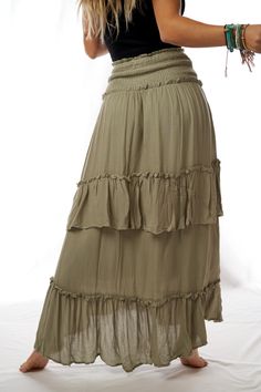 Feeling like we washed ashore in the most amazing skirt ever! Our Washed Ashore Maxi Skirt features a wide smocked elastic waistband and asymmetrical hem with ruffle tiers. Wear as a skirt or pull up to wear as a dress, the versatility of this piece makes it a closet essential. Its effortless boho vibes make it a daily staple! *Due to lighting and differences in monitors, actual colors may vary slightly from what appears online. Model is 5'4" and wearing a size Small. Approximate measurements ar Ruffled Maxi Skirt, Crochet High Neck, Washed Ashore, Ruffle Maxi Skirt, Closet Essentials, Crochet Trim, Boho Vibe, Asymmetrical Hem, Pull Up